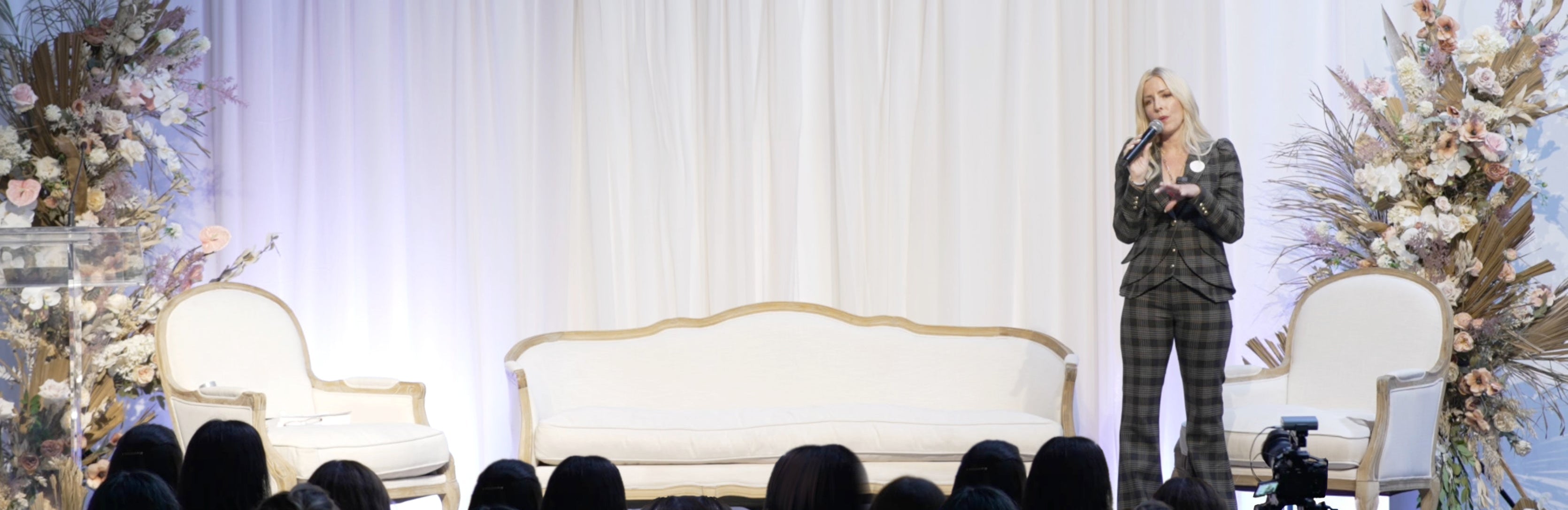 Gina Livy speaking at the Auric conference