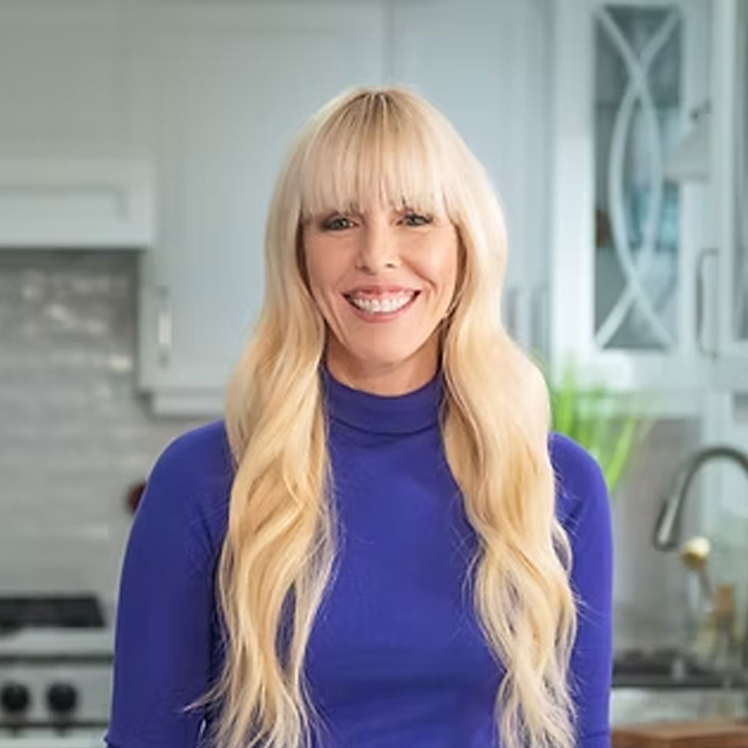 Photo of Gina Livy in a kitchen